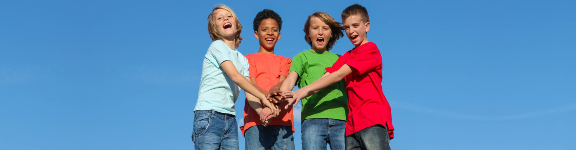 Group of diverse kids or teens hands together